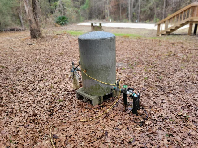 a view of a backyard of the house