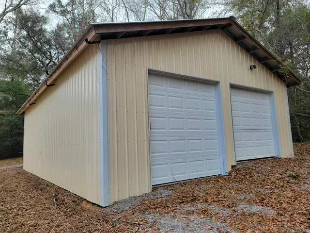 a view of dirt yard with large trees