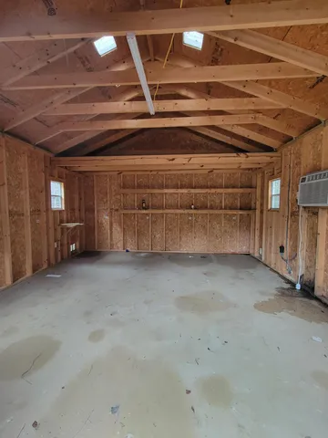 a view of a room with wooden walls