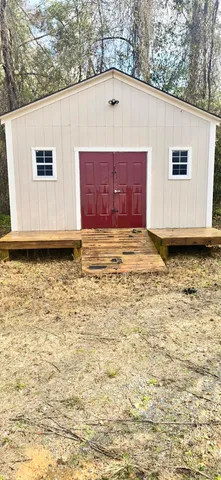 a view of a backyard of a house