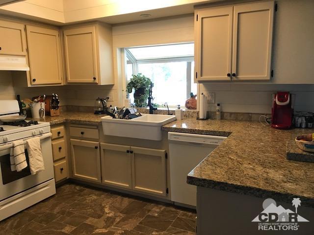 35280 Tool Box Spring Road Mountain Center, CA 92561 - Photo 13 of 29 a kitchen with sink cabinets and window