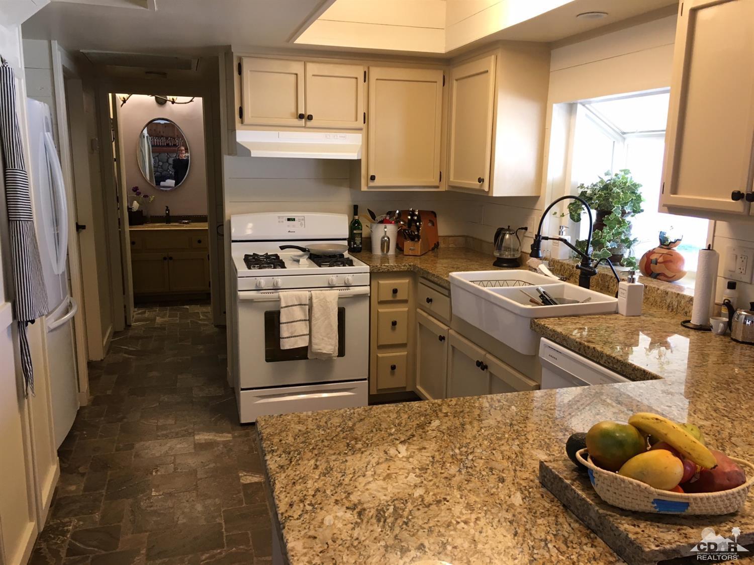 35280 Tool Box Spring Road Mountain Center, CA 92561 - Photo 14 of 29 a kitchen with stainless steel appliances granite countertop a sink stove and refrigerator