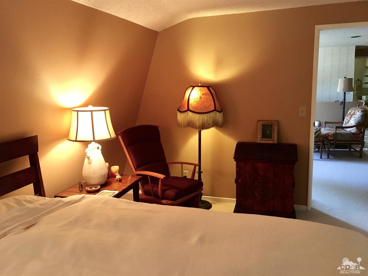 35280 Tool Box Spring Road Mountain Center, CA 92561 - Photo 16 of 29 a bedroom with a bed and lamp