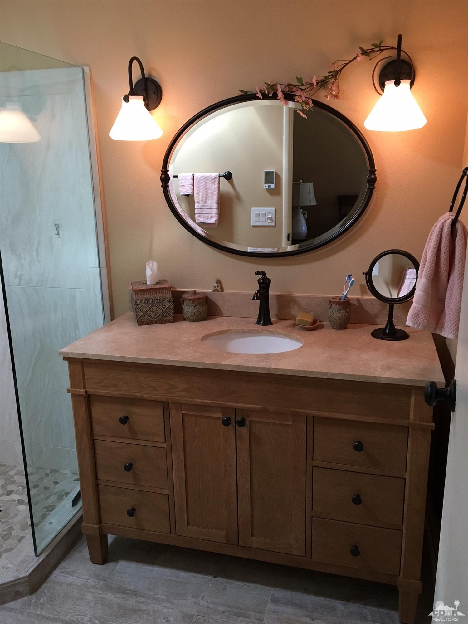 35280 Tool Box Spring Road Mountain Center, CA 92561 - Photo 20 of 29 a bathroom with a sink and a mirror