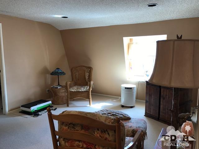 35280 Tool Box Spring Road Mountain Center, CA 92561 - Photo 23 of 29 a bedroom with furniture and a lamp