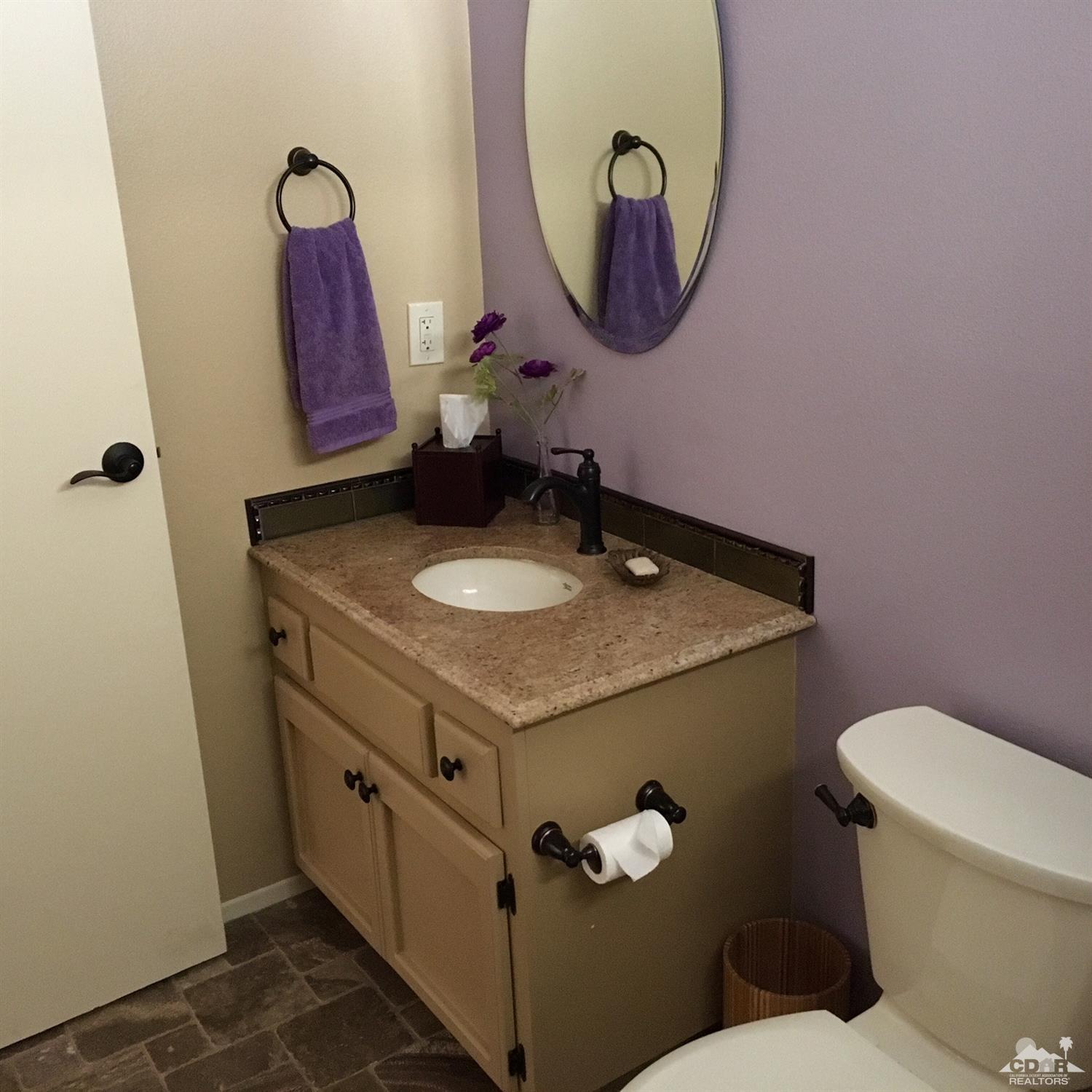 35280 Tool Box Spring Road Mountain Center, CA 92561 - Photo 27 of 29 a bathroom with a granite countertop sink and a mirror