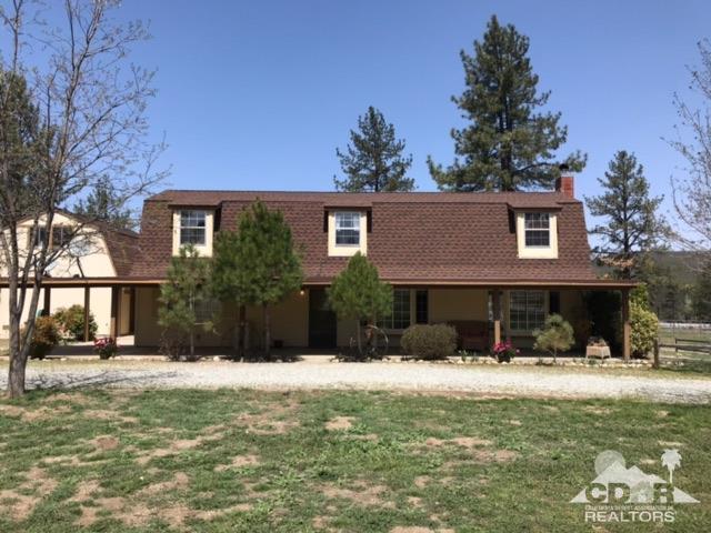 35280 Tool Box Spring Road Mountain Center, CA 92561 - Photo 4 of 29 a front view of a house with a yard
