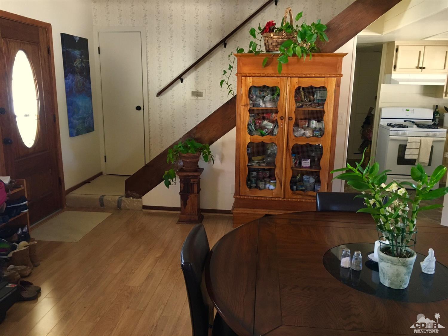35280 Tool Box Spring Road Mountain Center, CA 92561 - Photo 7 of 29 a view of an entryway with a flower pot and a living room