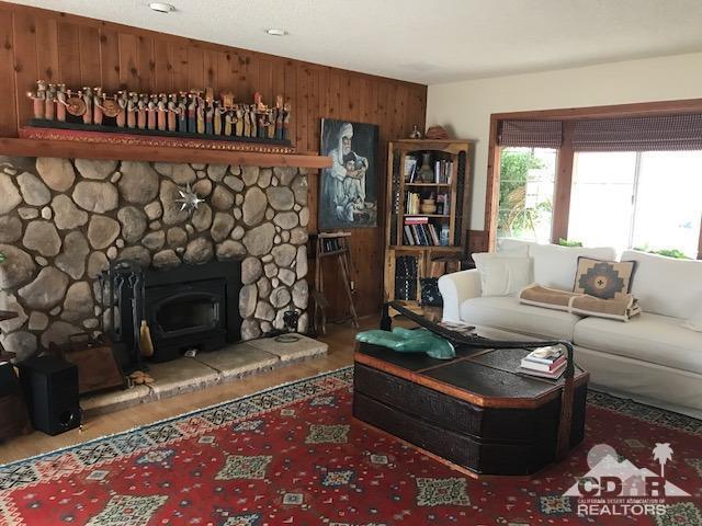 35280 Tool Box Spring Road Mountain Center, CA 92561 - Photo 8 of 29 a living room with furniture a fireplace and a rug