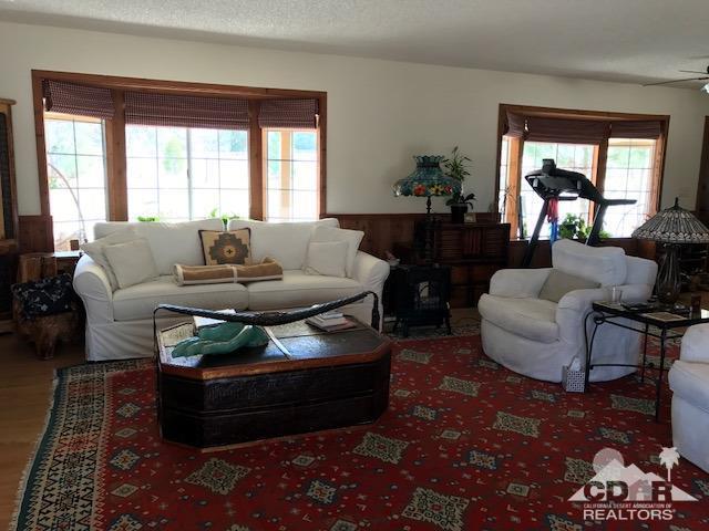 35280 Tool Box Spring Road Mountain Center, CA 92561 - Photo 9 of 29 a living room with furniture and a large window