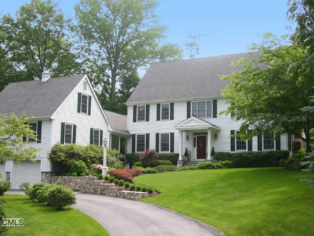 73 Nursery Road Ridgefield, CT 06877 - Photo 1 of 1 a front view of a house with a yard and trees