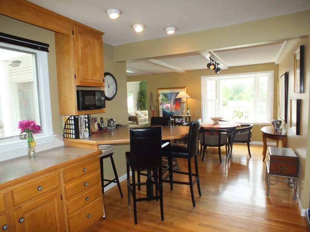 17 Orchard Road East Longmeadow, MA 01028 - Photo 12 of 30 a large kitchen with sink cabinets dining table and chairs