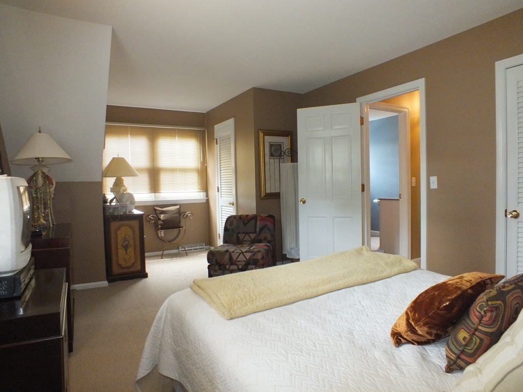 17 Orchard Road East Longmeadow, MA 01028 - Photo 21 of 30 a bedroom with a bed and wooden floor