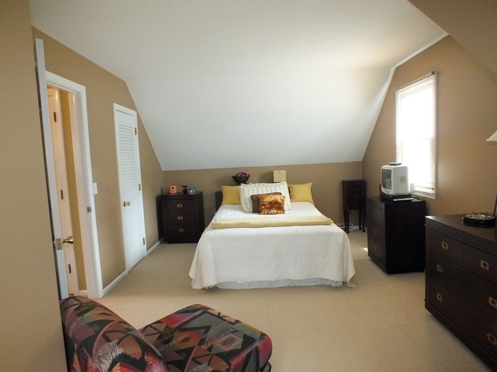 17 Orchard Road East Longmeadow, MA 01028 - Photo 22 of 30 a bedroom with a bed and wooden floor