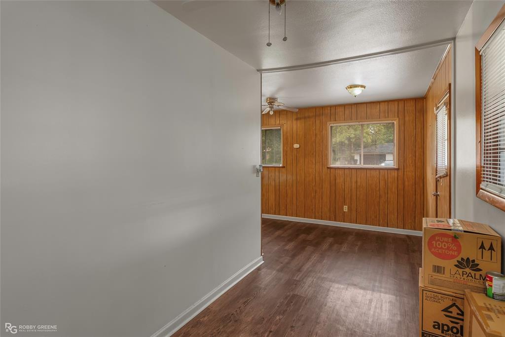 8321 Kingston Road Shreveport, LA 71108 - Photo 13 of 22 an empty room with wooden floor and windows