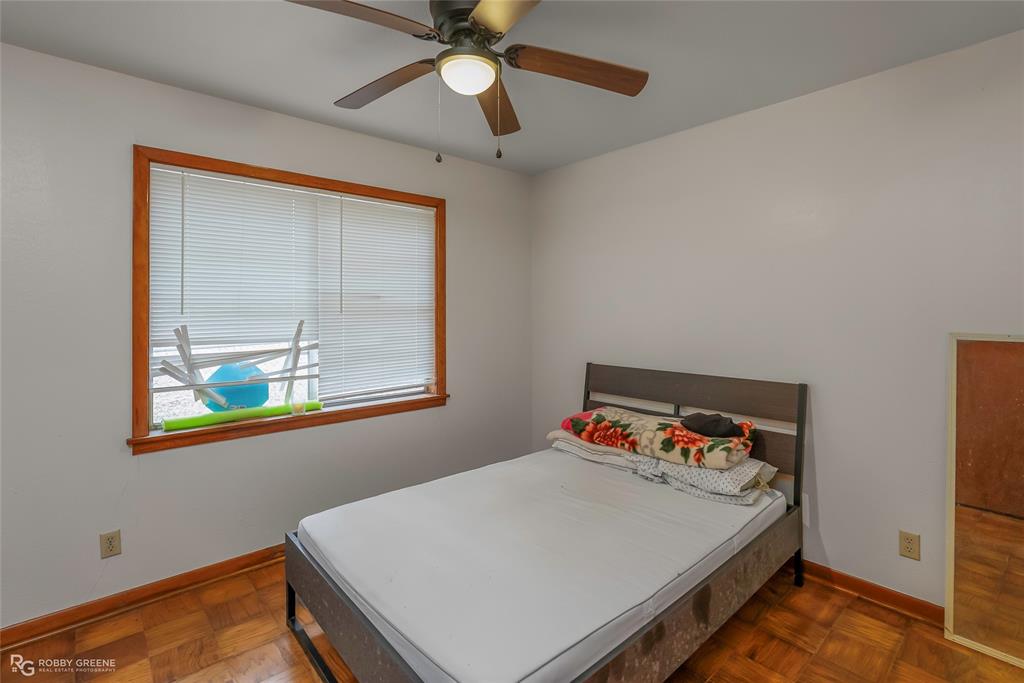 8321 Kingston Road Shreveport, LA 71108 - Photo 17 of 22 a bed room with a bed and a window