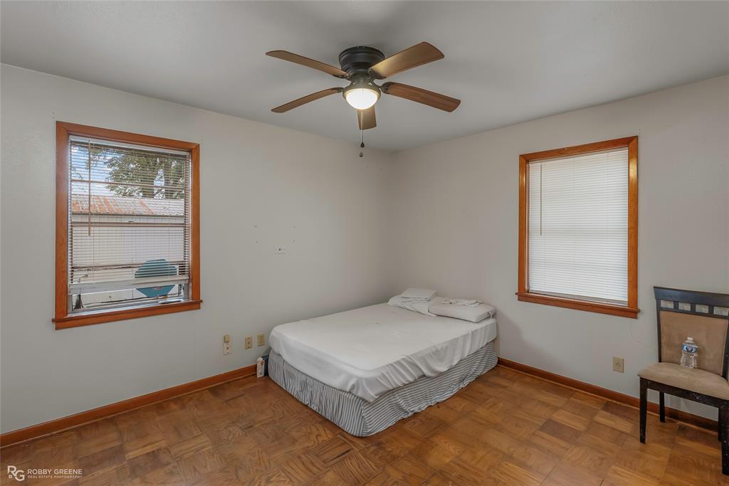 8321 Kingston Road Shreveport, LA 71108 - Photo 19 of 22 a bedroom with a bed and window