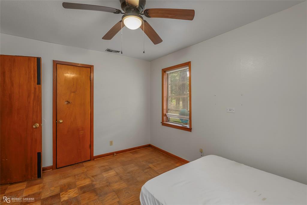 8321 Kingston Road Shreveport, LA 71108 - Photo 20 of 22 a bedroom with a bed and a window