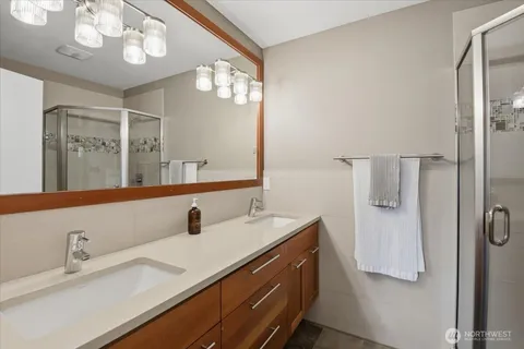 a bathroom with a sink vanity and a mirror
