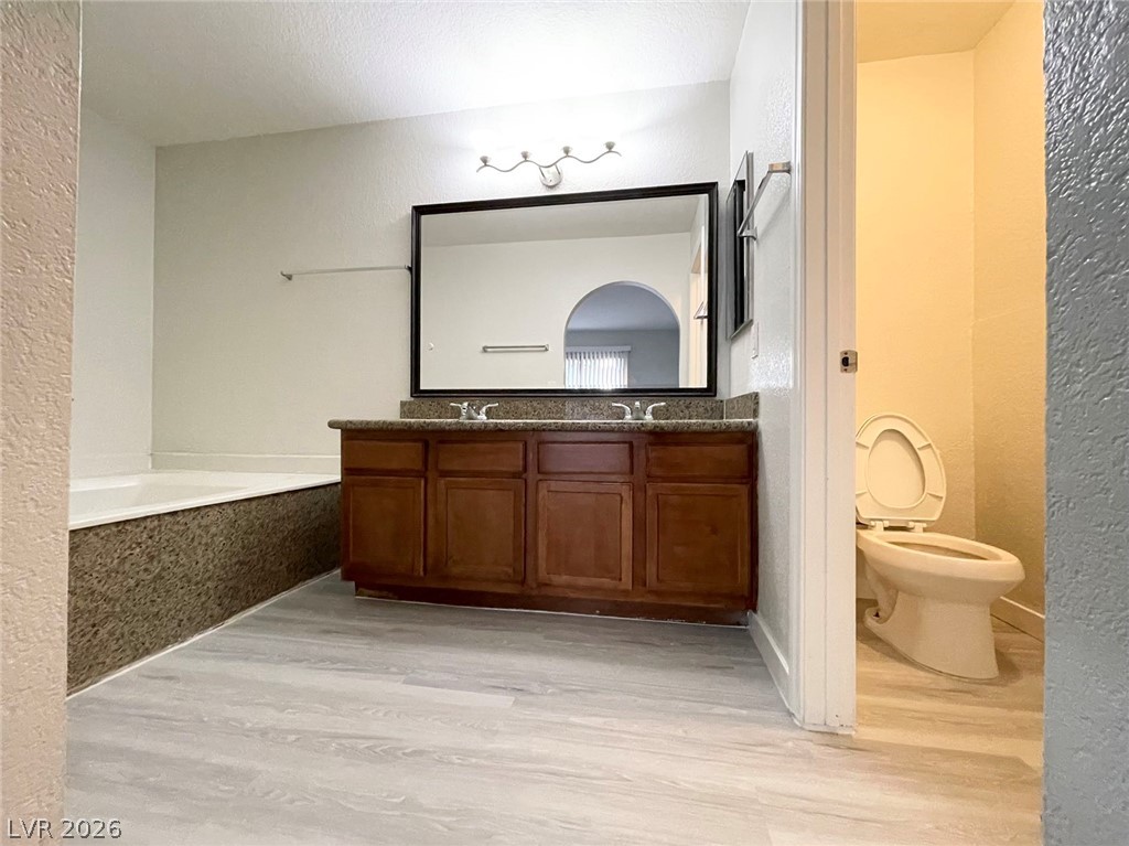 1834 North Decatur Boulevard, Unit 204 Las Vegas, NV 89108 - Photo 6 of 17 A well-appointed bath features a dual vanity and a private water closet.