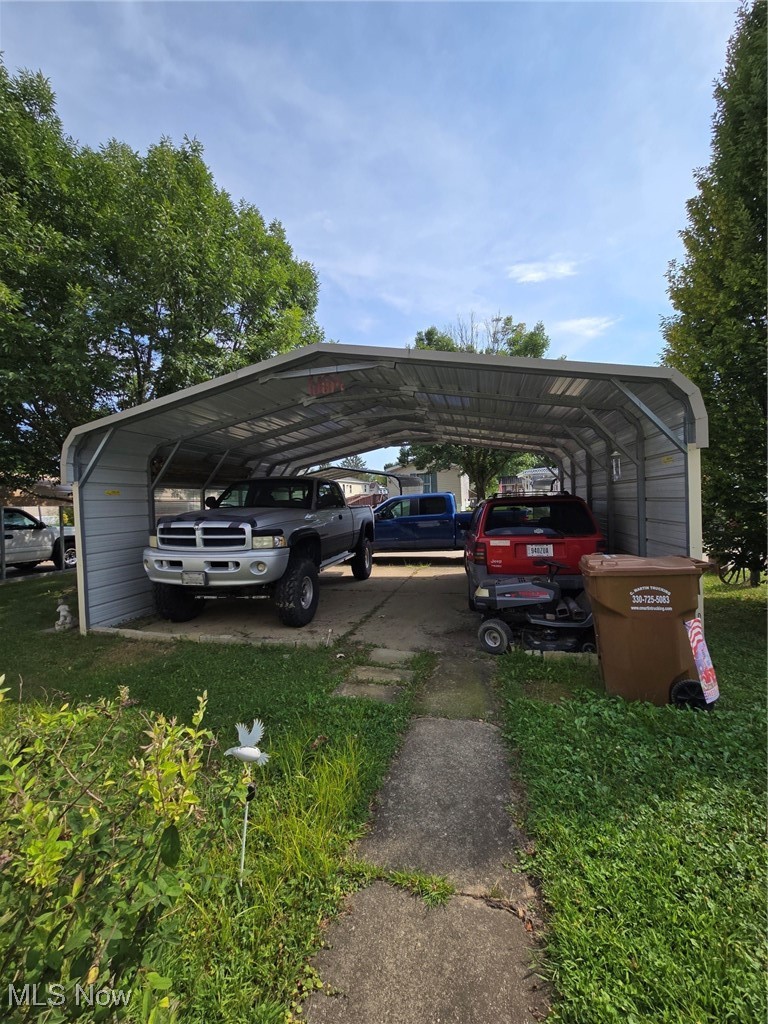 5974 Cleveland Road, Unit 23 Wooster, OH 44691 - Photo 23 of 29 View of vehicle parking with a detached carport