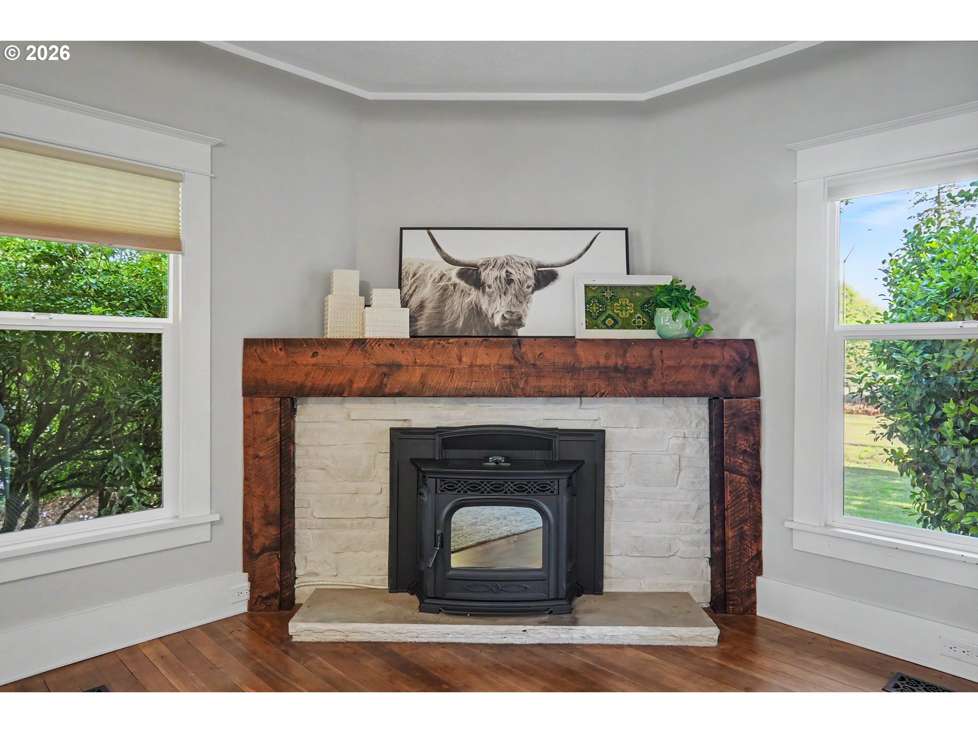 15055 Southeast Foster Road Dayton, OR 97114 - Photo 19 of 47 a living room with a fireplace and a potted plant