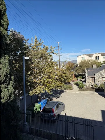 a view of a street with cars on road