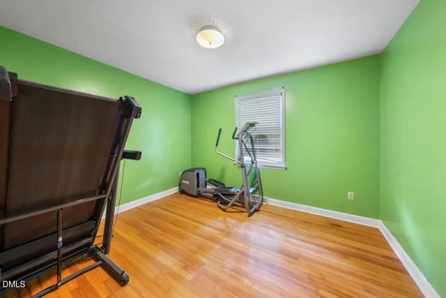 a bathroom with a sink mirror and toilet