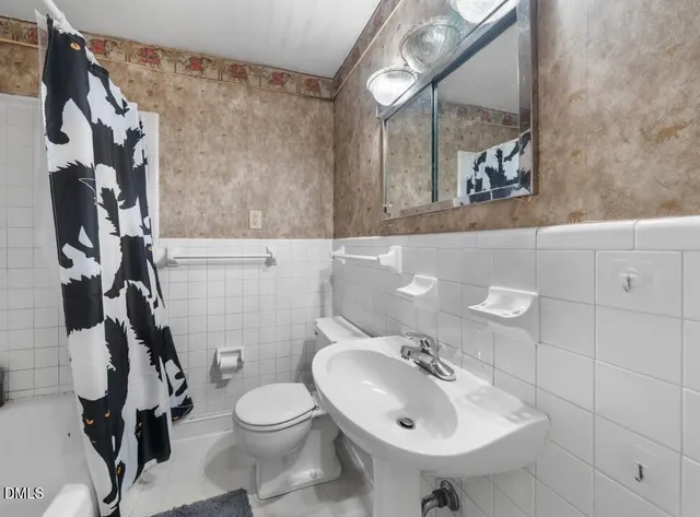 a view of a park with large trees