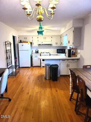 a kitchen with stainless steel appliances granite countertop a sink and stove