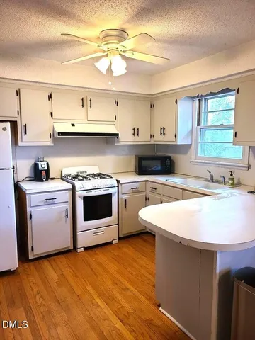 a bedroom with a bed and a table