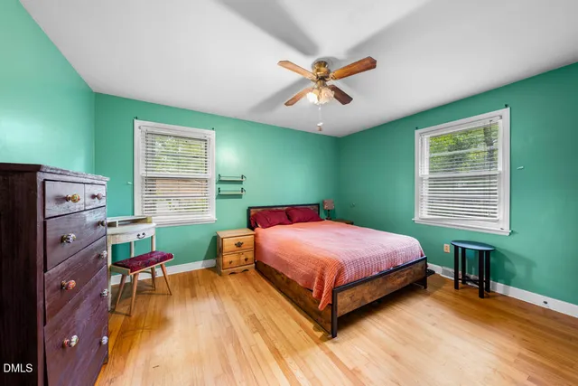 a bathroom with a toilet sink and a mirror