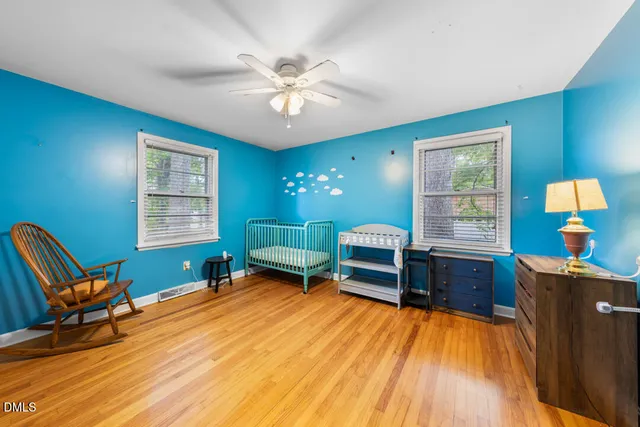 a room with a window and a wooden floor