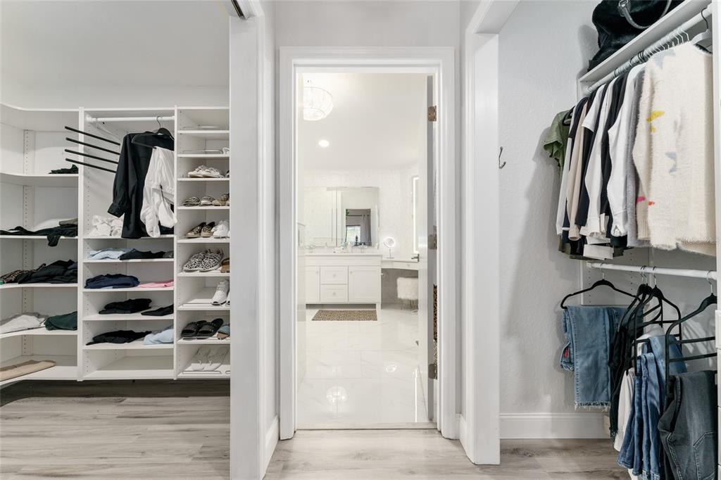 4841 Northwest 76th Court Ocala, FL 34482 - Photo 17 of 40 a view of walk in closet with clothes and shoes