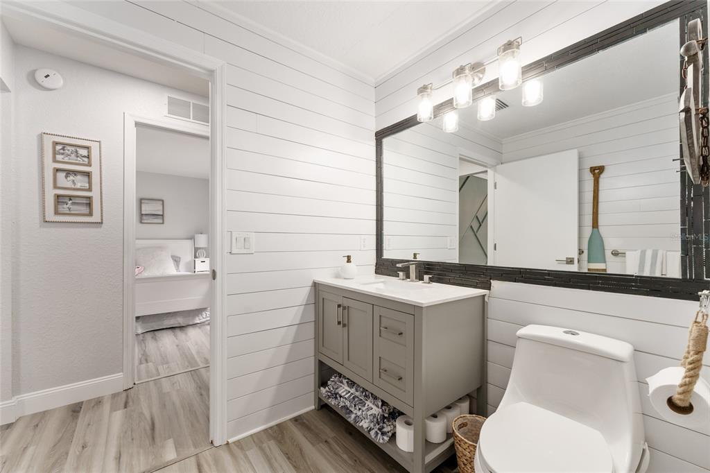 4841 Northwest 76th Court Ocala, FL 34482 - Photo 19 of 40 a bathroom with a sink a toilet and mirror