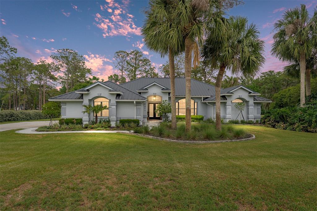 4841 Northwest 76th Court Ocala, FL 34482 - Photo 2 of 40 a front view of house with yard and green space