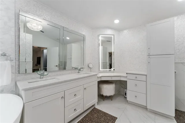 a spacious bathroom with a granite countertop sink mirror and toilet