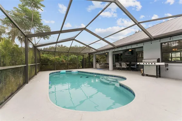 a view of a swimming pool with a patio