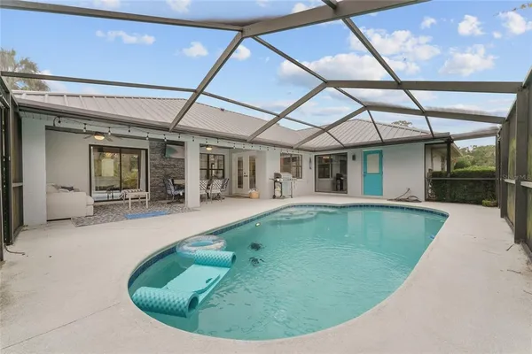 a view of a house with swimming pool