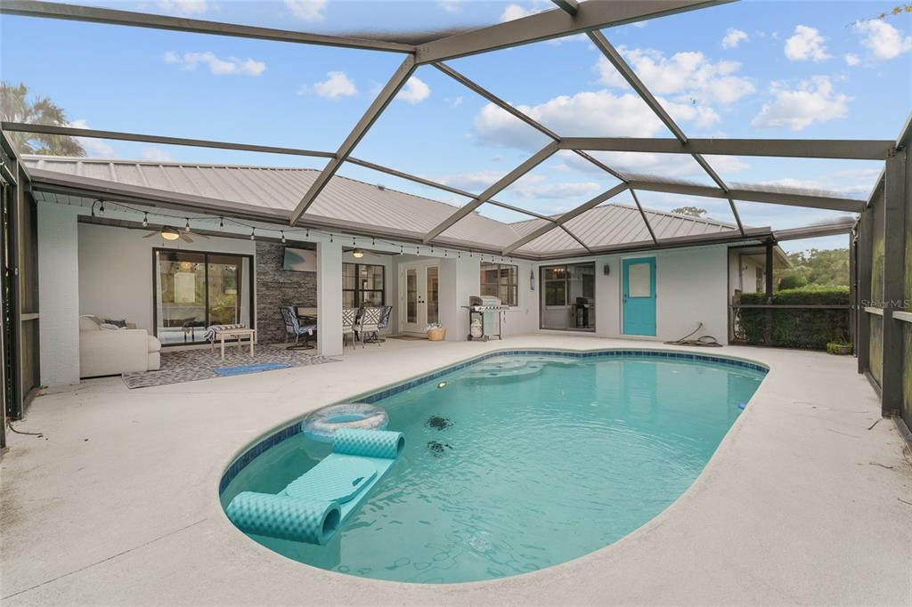 4841 Northwest 76th Court Ocala, FL 34482 - Photo 27 of 40 a view of a house with swimming pool