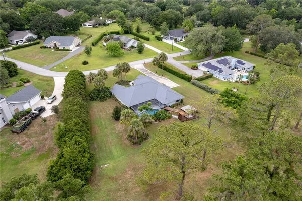 an aerial view of residential house with outdoor space