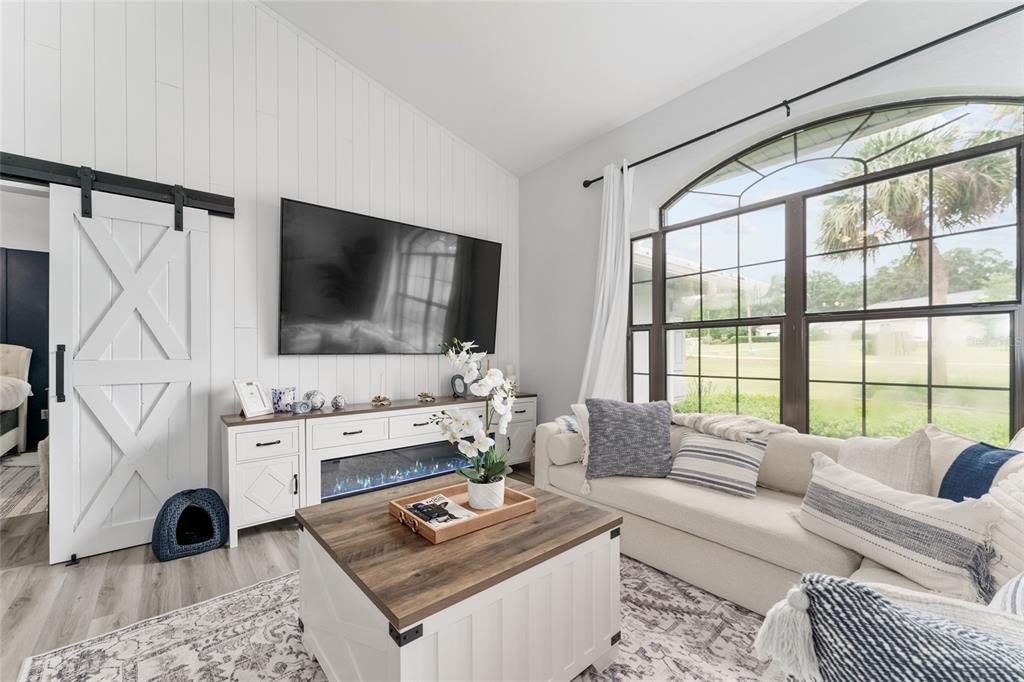 4841 Northwest 76th Court Ocala, FL 34482 - Photo 5 of 40 a living room with furniture and a flat screen tv