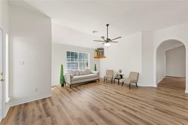 a view of a livingroom with furniture and furniture