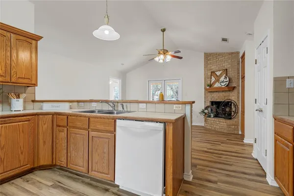 a view of a kitchen from the hallway