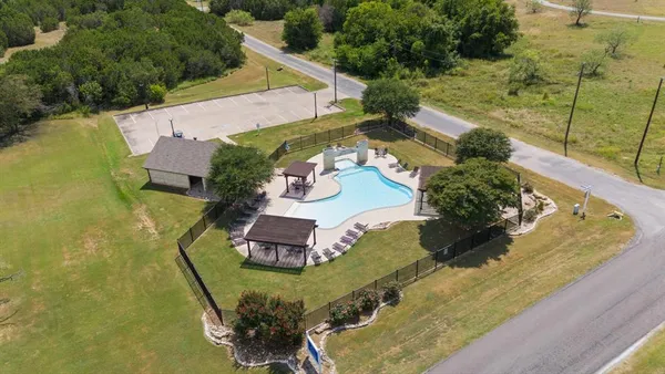 an aerial view of a house with outdoor space