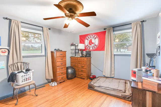 a bedroom with furniture and a window