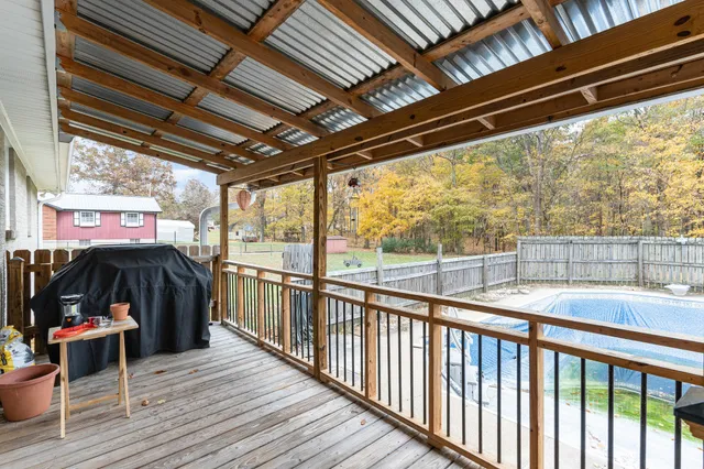 a view of a porch with wooden floor