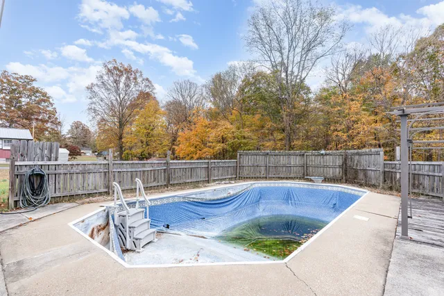 a view of swimming pool with patio