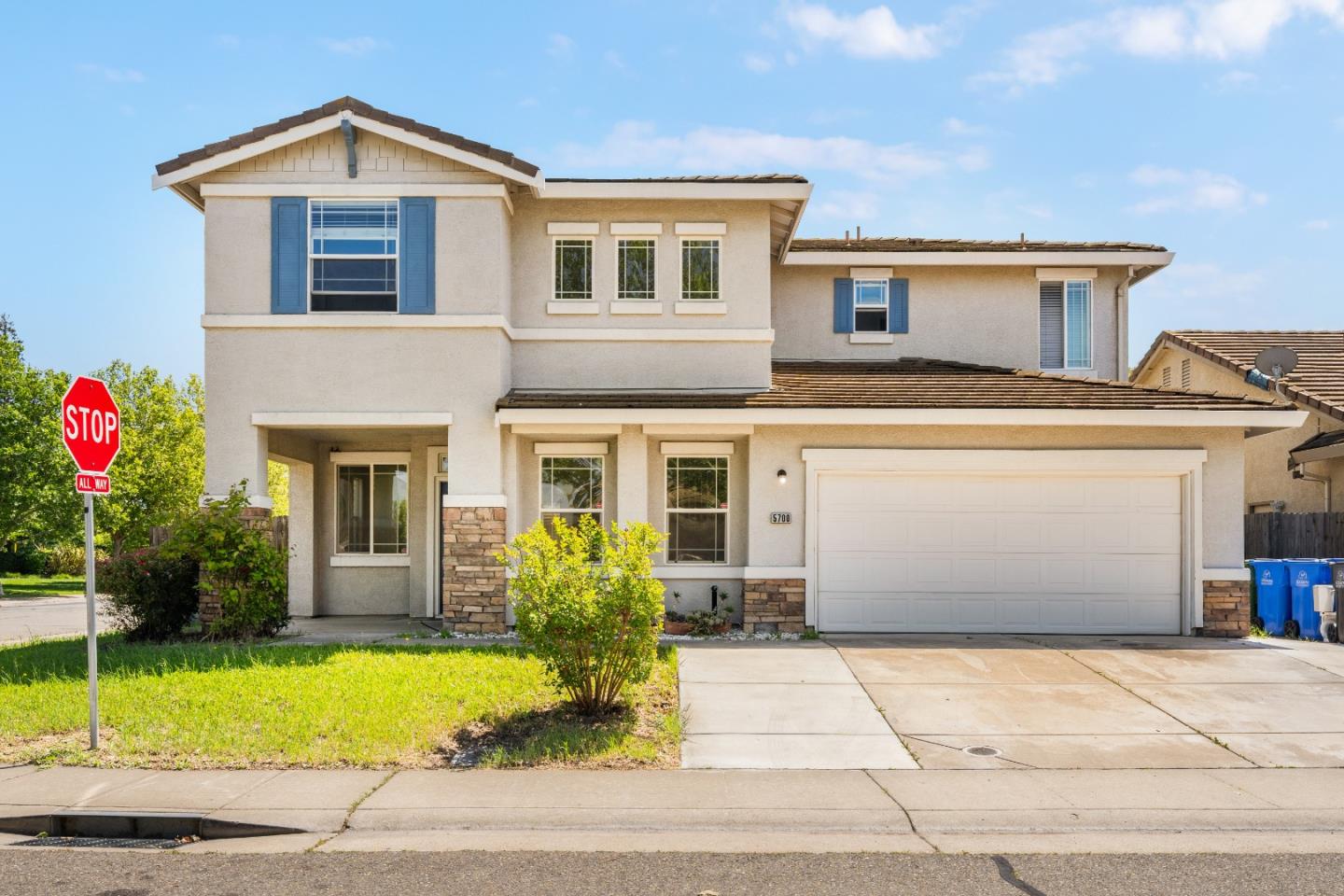 5700 Gold Poppy Way Elk Grove, CA 95757 - Photo 1 of 49 a front view of a house with garden