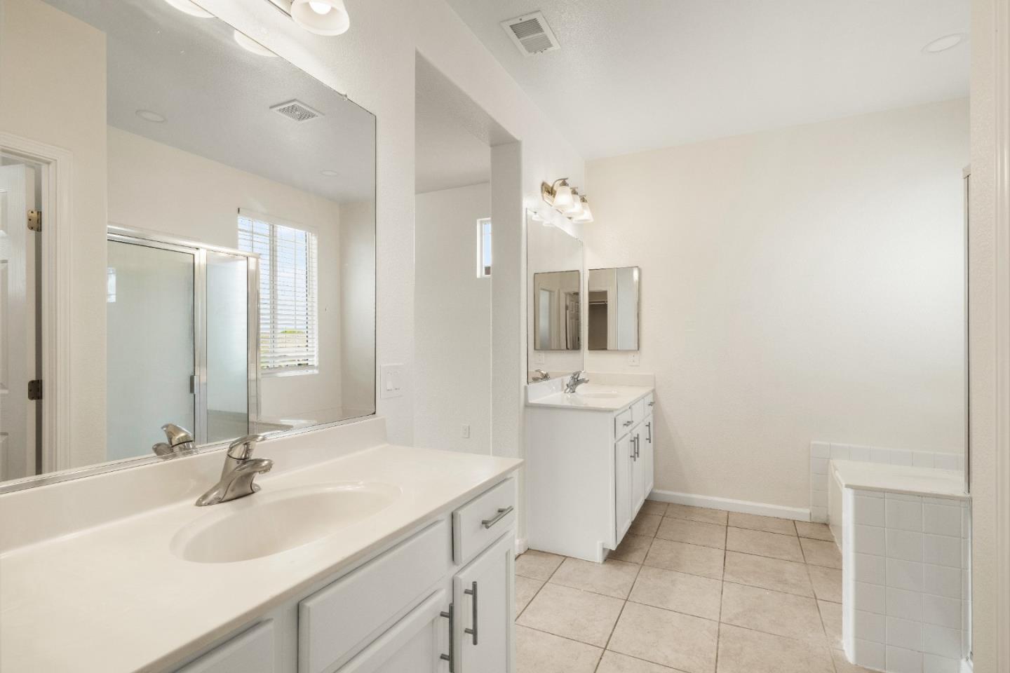 5700 Gold Poppy Way Elk Grove, CA 95757 - Photo 18 of 49 a bathroom with a sink and a mirror